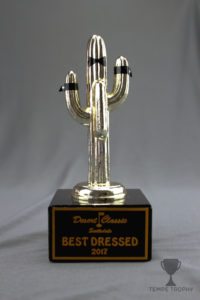 Custom trophy for "Best Dressed" with a gold cactus figurine with a bow tie and suit cuffs on a black marble base.