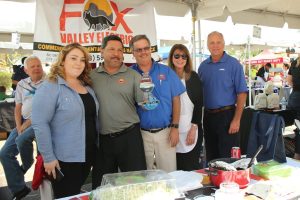 5 representatives from Fox Valley Electric holding up the Cook-off Trophy Tempe Trophy made for the Anixter Trade Show.