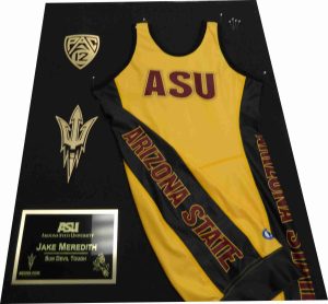 ASU wrestling jersey display with a plaque engraved by Tempe Trophy.