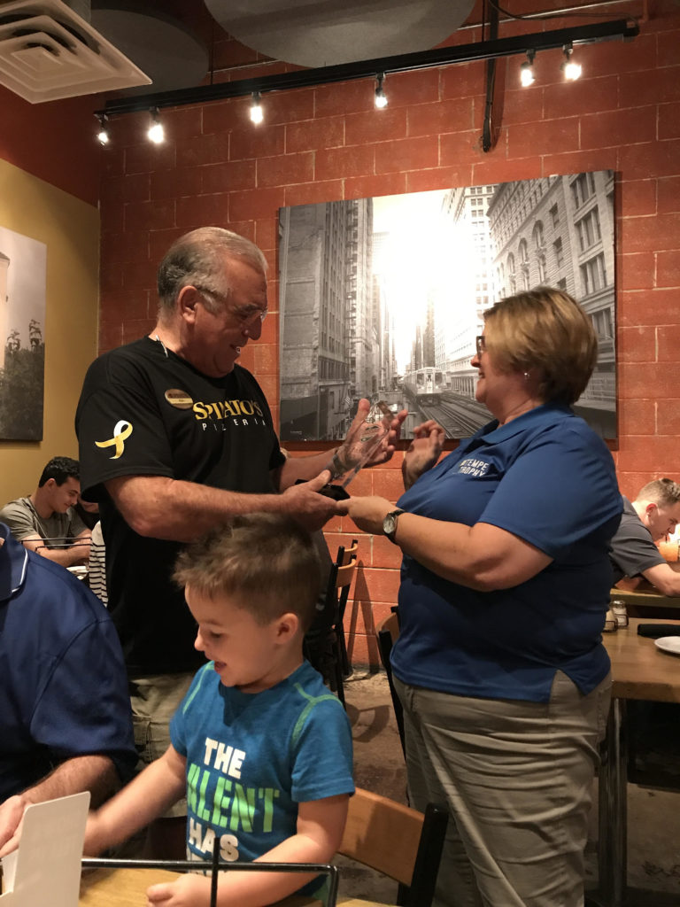 Sue posing with the owner of Spinelli's as he receives their Best of Tempe Trophy award.